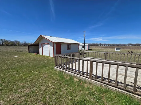 a view of a house with a yard from a balcony