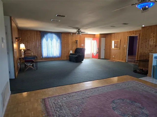 a view of a livingroom with furniture