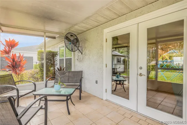 a patio with glass door and glass door