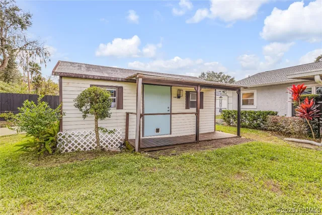 a view of a front of a house with a yard