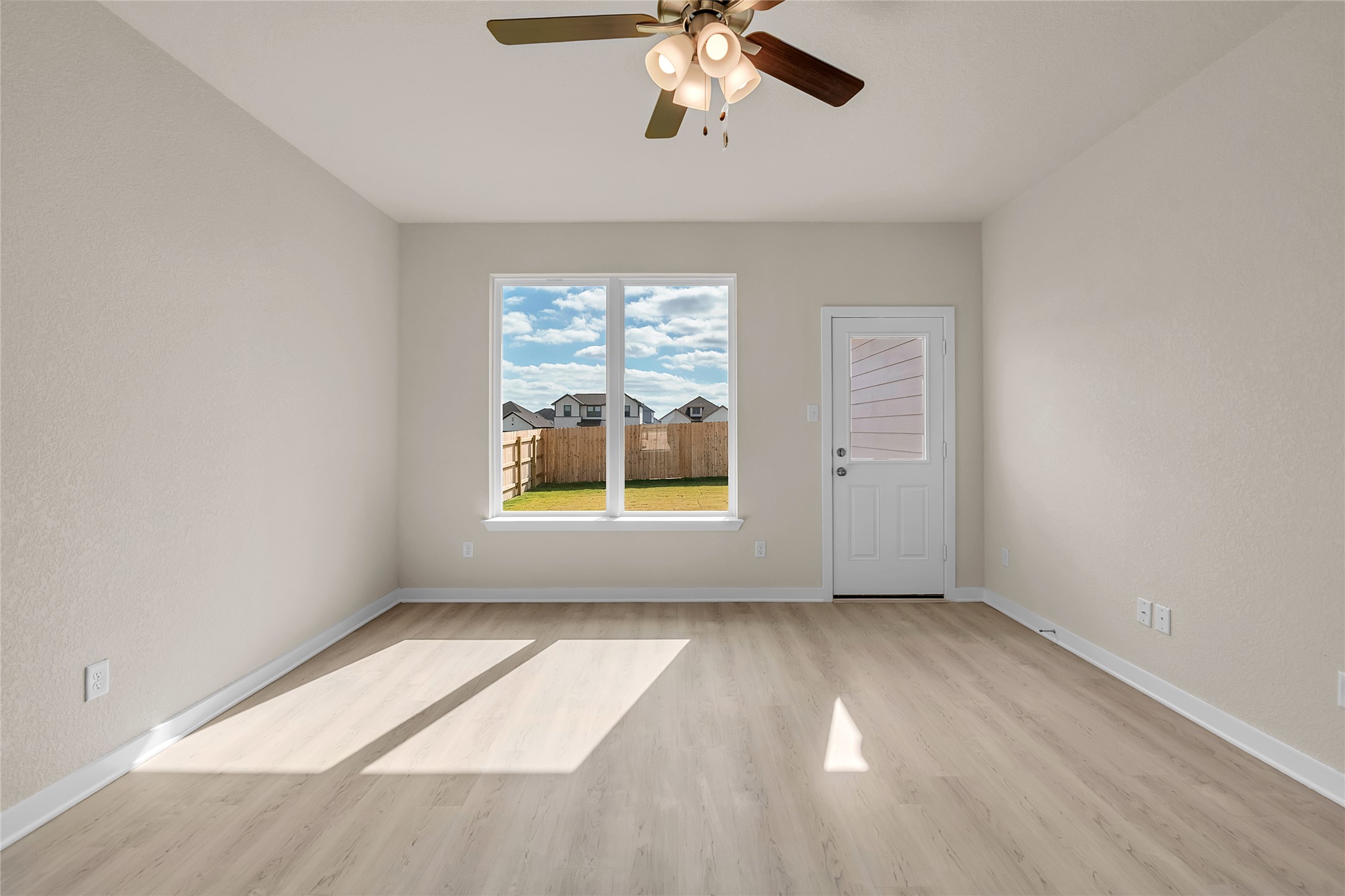 290 Boatright Boulevard Jarrell, TX 76537 - Photo 11 of 32 Spare room featuring light wood-style flooring and a ceiling fan
