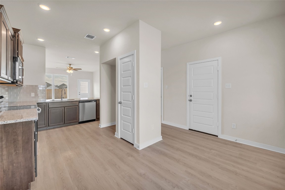 290 Boatright Boulevard Jarrell, TX 76537 - Photo 16 of 32 a view of a kitchen with a sink and a refrigerator