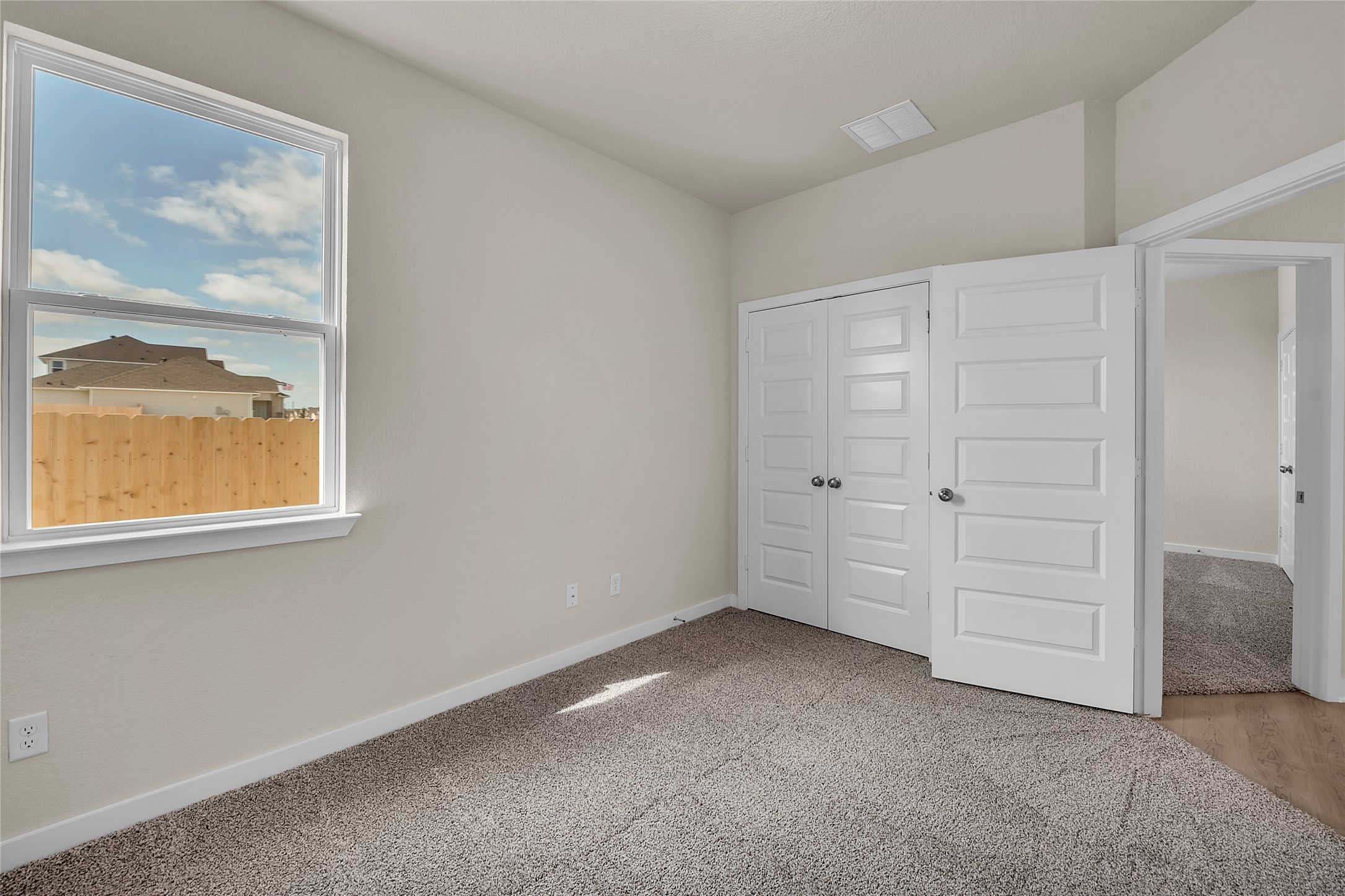 290 Boatright Boulevard Jarrell, TX 76537 - Photo 20 of 32 Unfurnished bedroom featuring a closet and light carpet