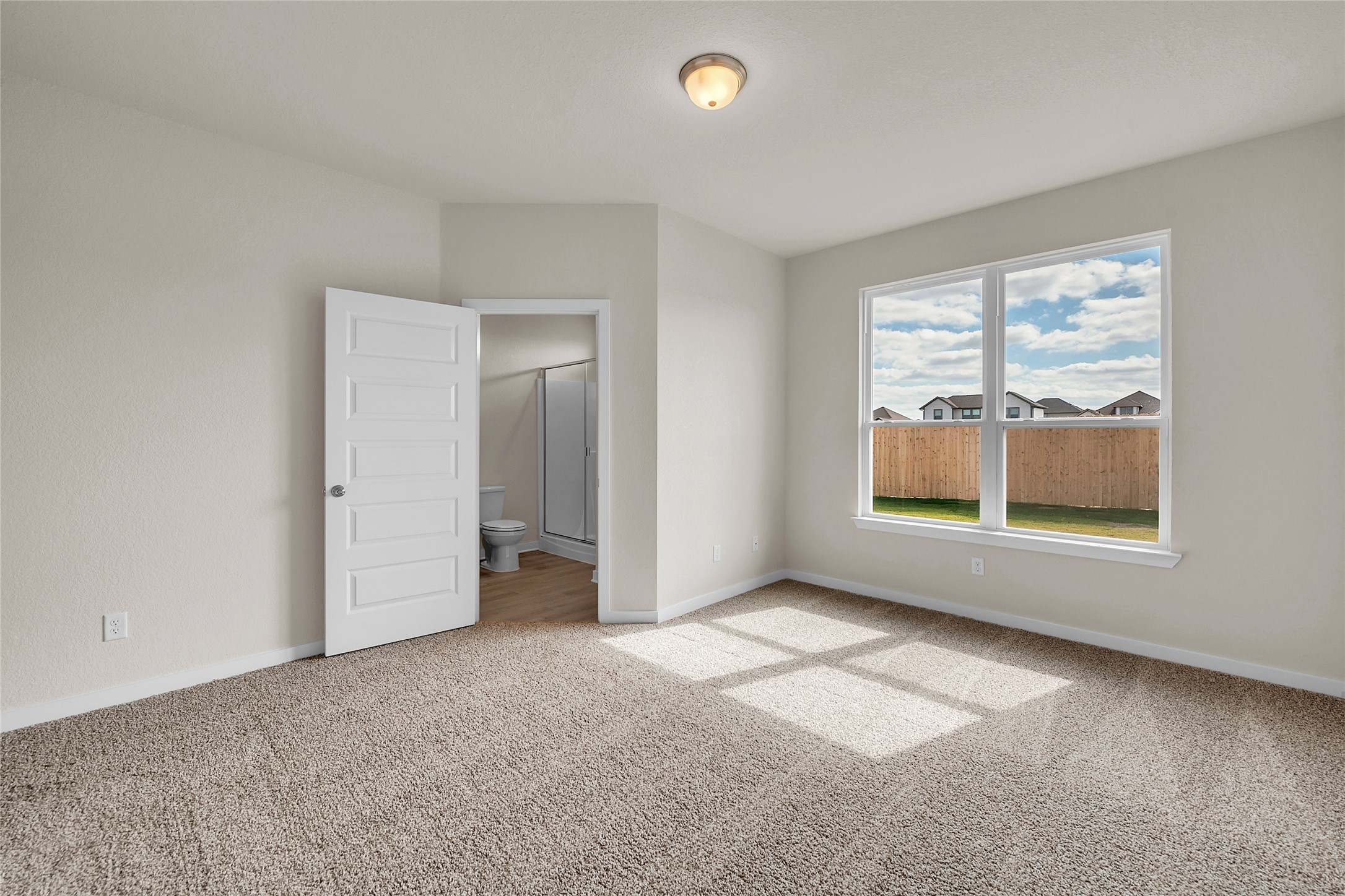 290 Boatright Boulevard Jarrell, TX 76537 - Photo 25 of 32 Empty room with light colored carpet and baseboards