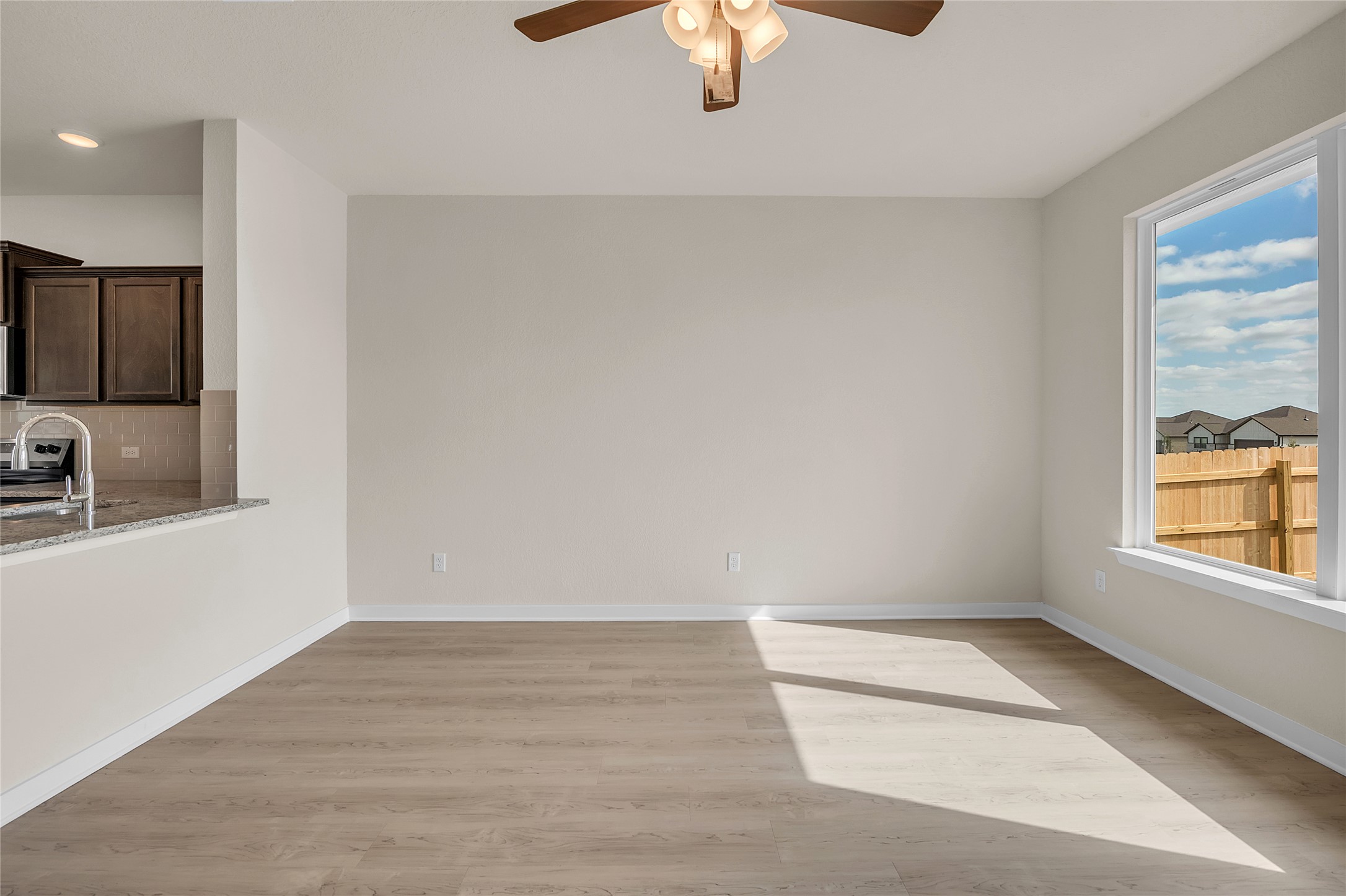 290 Boatright Boulevard Jarrell, TX 76537 - Photo 30 of 32 Unfurnished room with light wood-type flooring and a ceiling fan