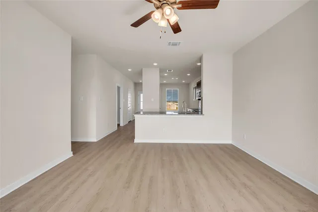 a view of a kitchen with a dishwasher cabinets and wooden floor
