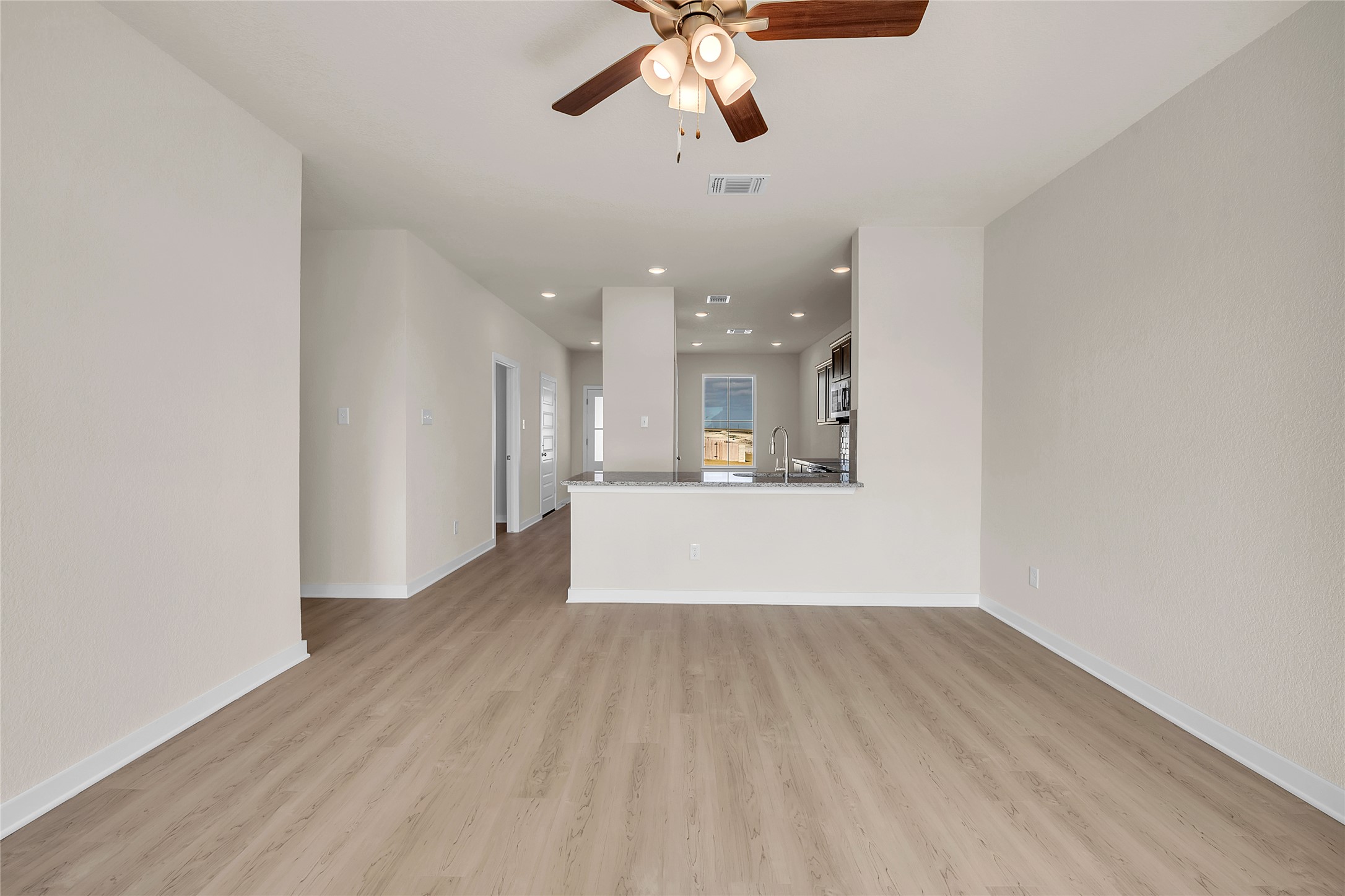 290 Boatright Boulevard Jarrell, TX 76537 - Photo 7 of 32 Unfurnished living room featuring recessed lighting, a ceiling fan, and light wood finished floors