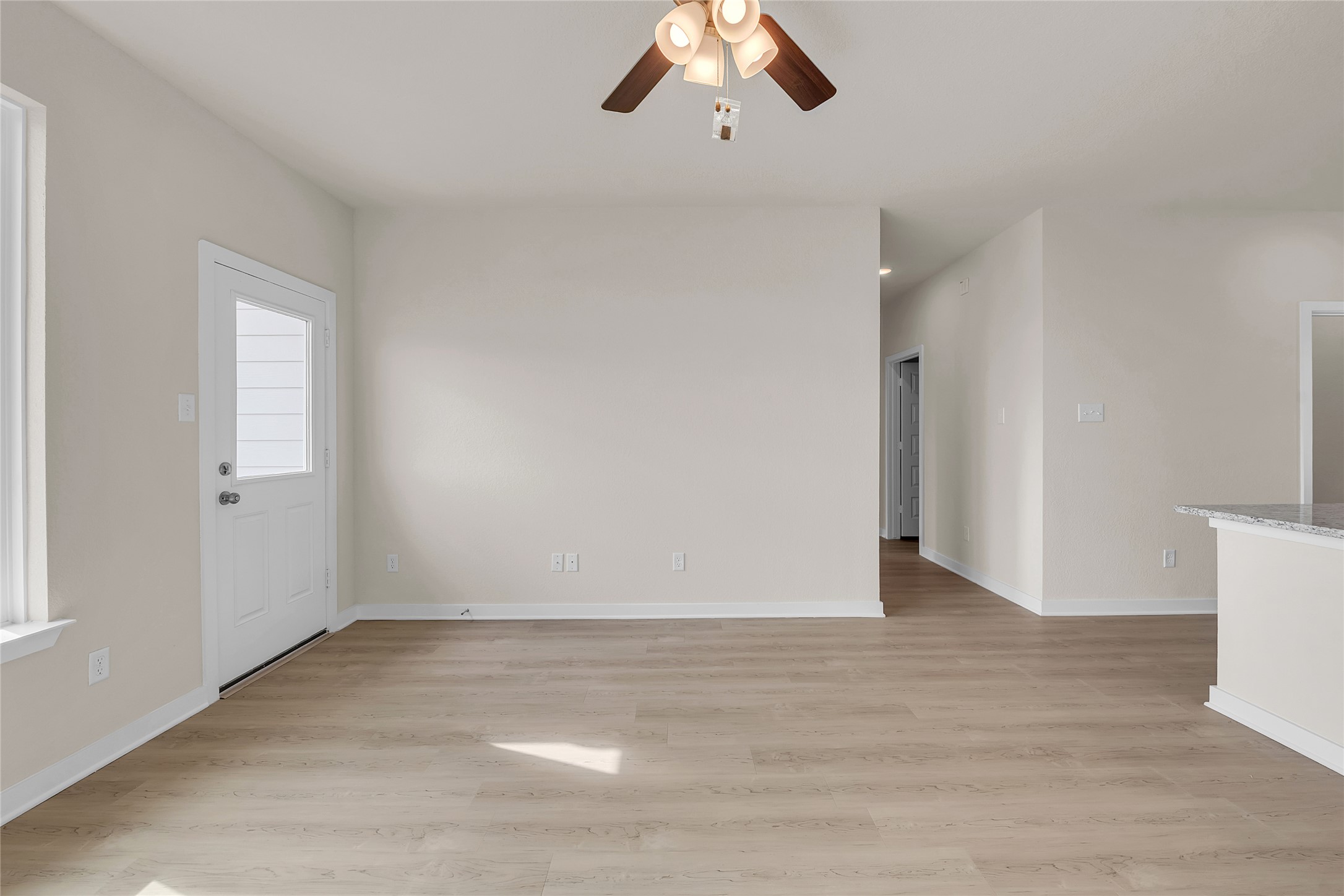 290 Boatright Boulevard Jarrell, TX 76537 - Photo 9 of 32 Unfurnished living room with light wood-type flooring and ceiling fan