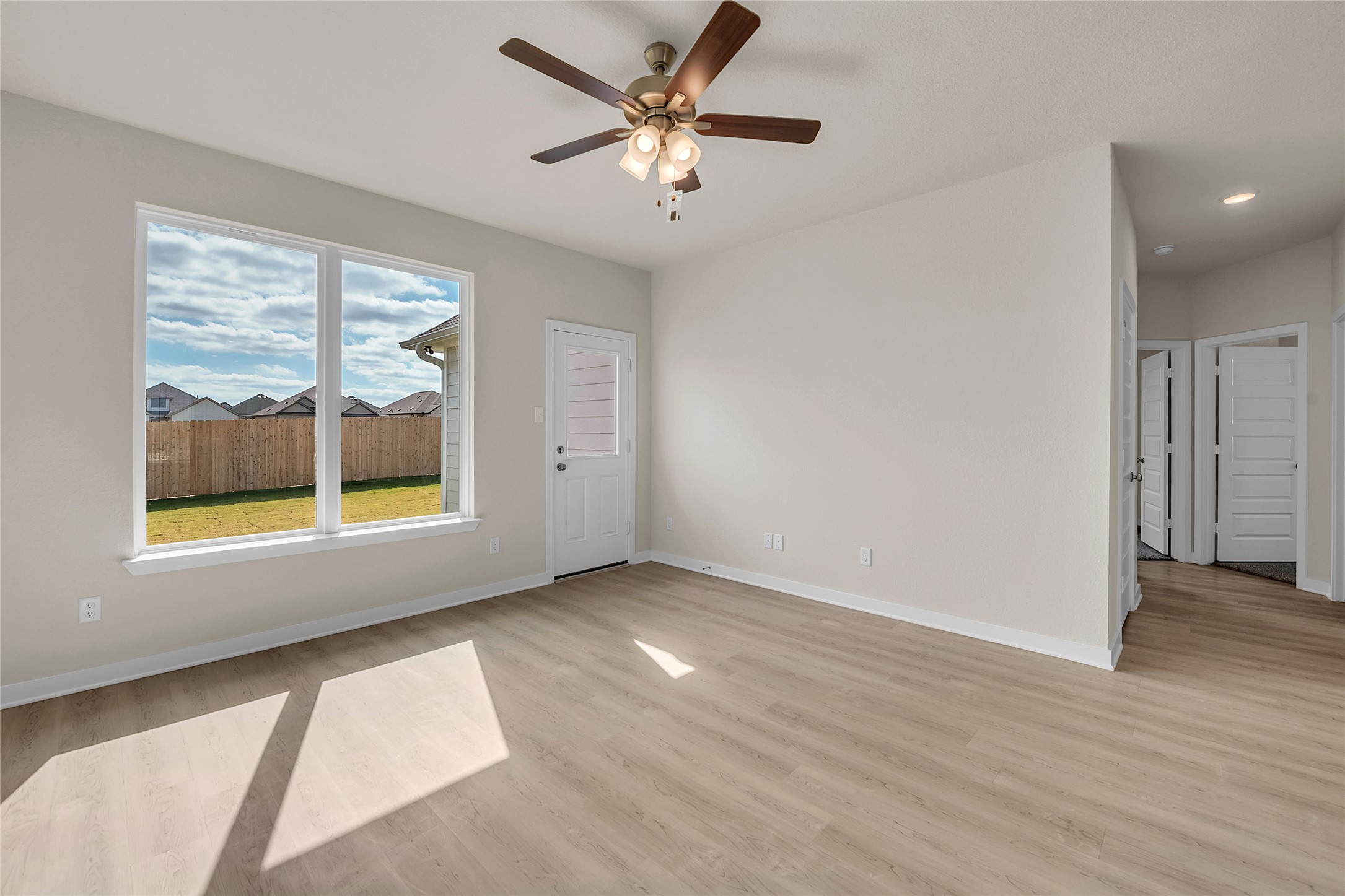 290 Boatright Boulevard Jarrell, TX 76537 - Photo 10 of 32 Spare room with light wood-style floors and ceiling fan