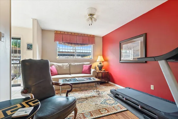 a living room with furniture and windows