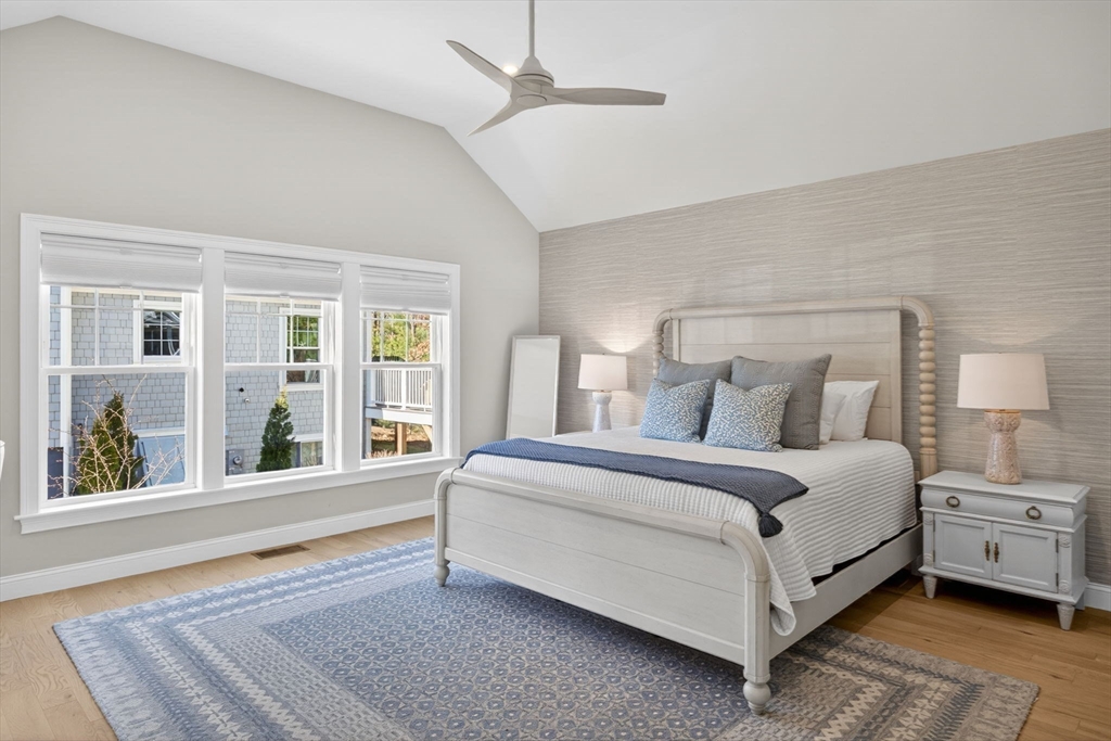 42 Cobblestone Circle Mashpee, MA 02649 - Photo 14 of 40 a spacious bedroom with a bed and a large window