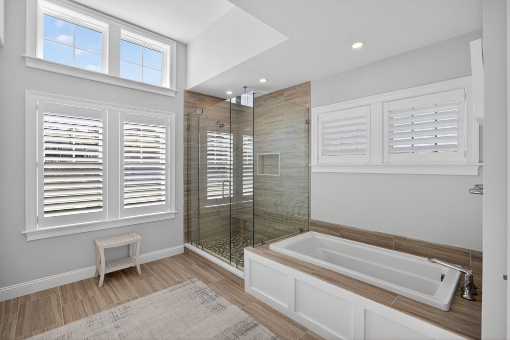 42 Cobblestone Circle Mashpee, MA 02649 - Photo 16 of 40 a bathroom with a bathtub and a shower