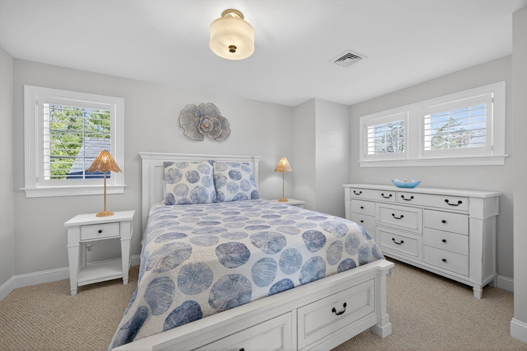 42 Cobblestone Circle Mashpee, MA 02649 - Photo 18 of 40 a bedroom with a bed and a window
