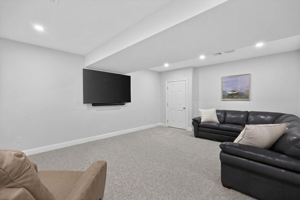 42 Cobblestone Circle Mashpee, MA 02649 - Photo 22 of 40 a living room with furniture and a flat screen tv