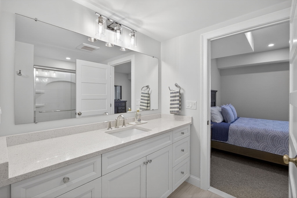 42 Cobblestone Circle Mashpee, MA 02649 - Photo 25 of 40 a en suite bathroom with a double vanity sink and a mirror