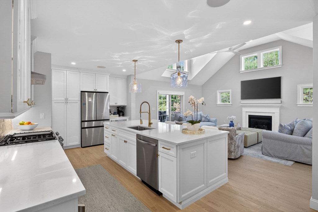 42 Cobblestone Circle Mashpee, MA 02649 - Photo 3 of 40 a kitchen with a sink stainless steel appliances and white cabinets