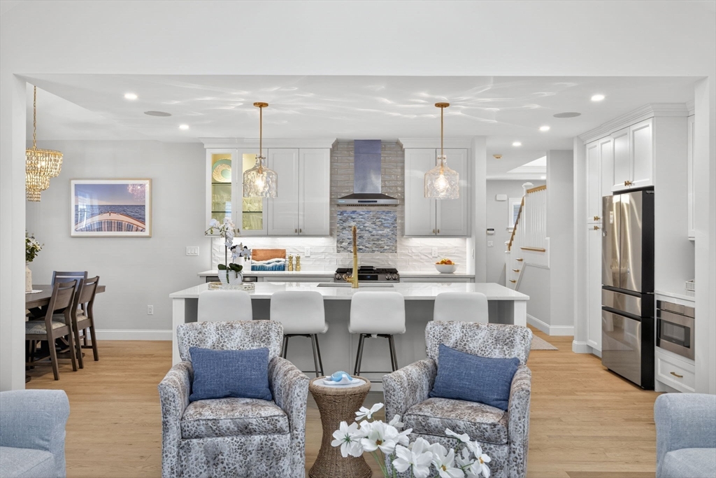 42 Cobblestone Circle Mashpee, MA 02649 - Photo 5 of 40 a large kitchen with a table and chairs