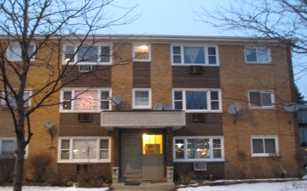 7858 Rutherford Avenue, Unit 2A Burbank, IL 60459 - Photo 6 of 10 a bricked building with multiple windows