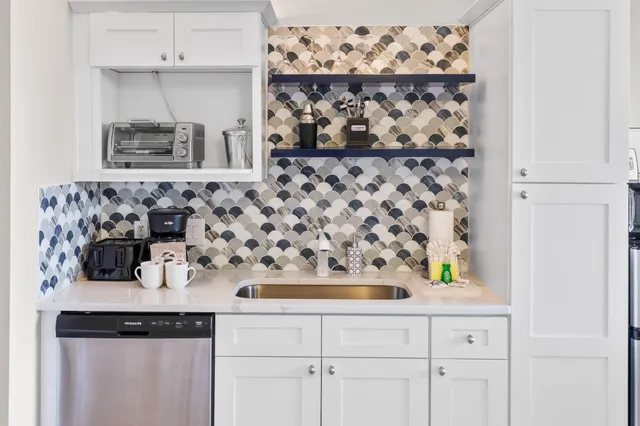 a bathroom with a bathtub and a sink