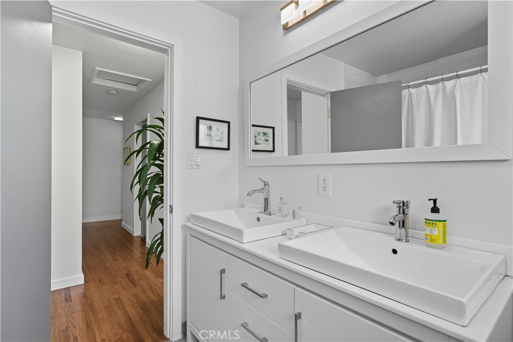 202 West Manchester Avenue Playa del Rey, CA 90293 - Photo 15 of 21 a bathroom with a sink and a mirror