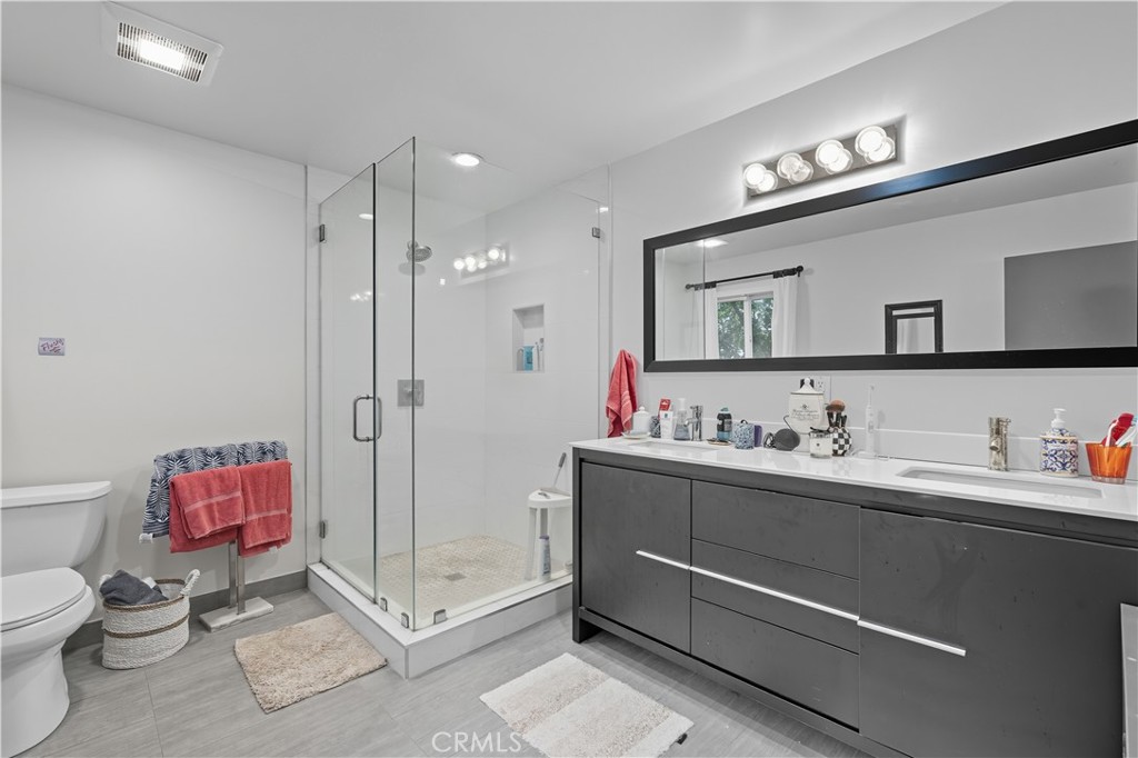 202 West Manchester Avenue Playa del Rey, CA 90293 - Photo 17 of 21 a bathroom with a toilet sink and mirror