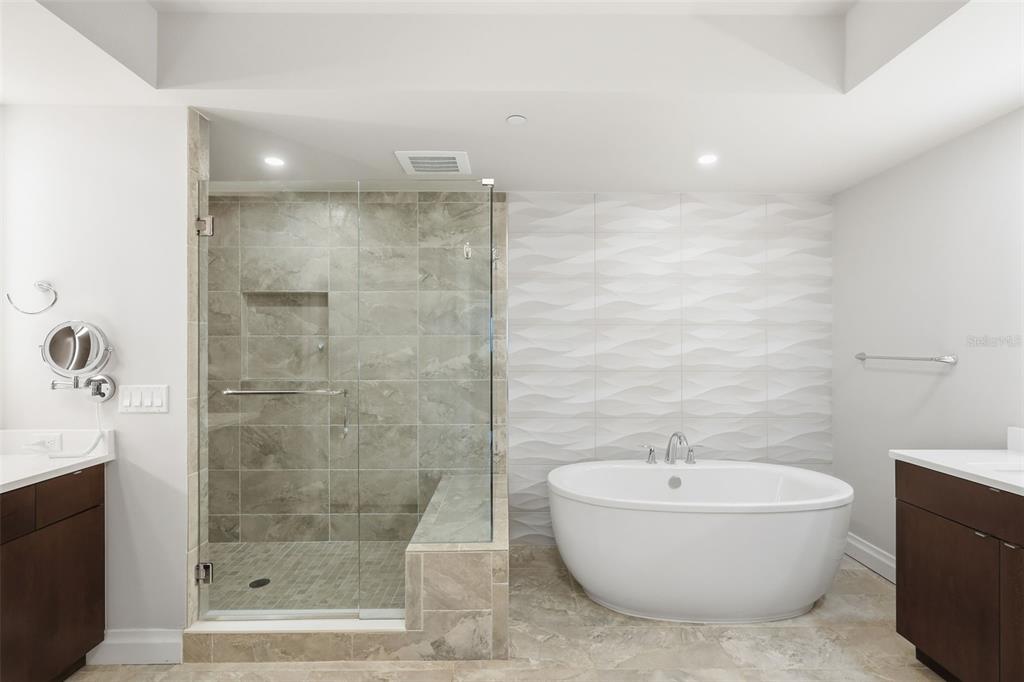 800 Collany Road, Unit 302 St. Petersburg, FL 33715 - Photo 58 of 66 a bathroom with a bathtub and shower