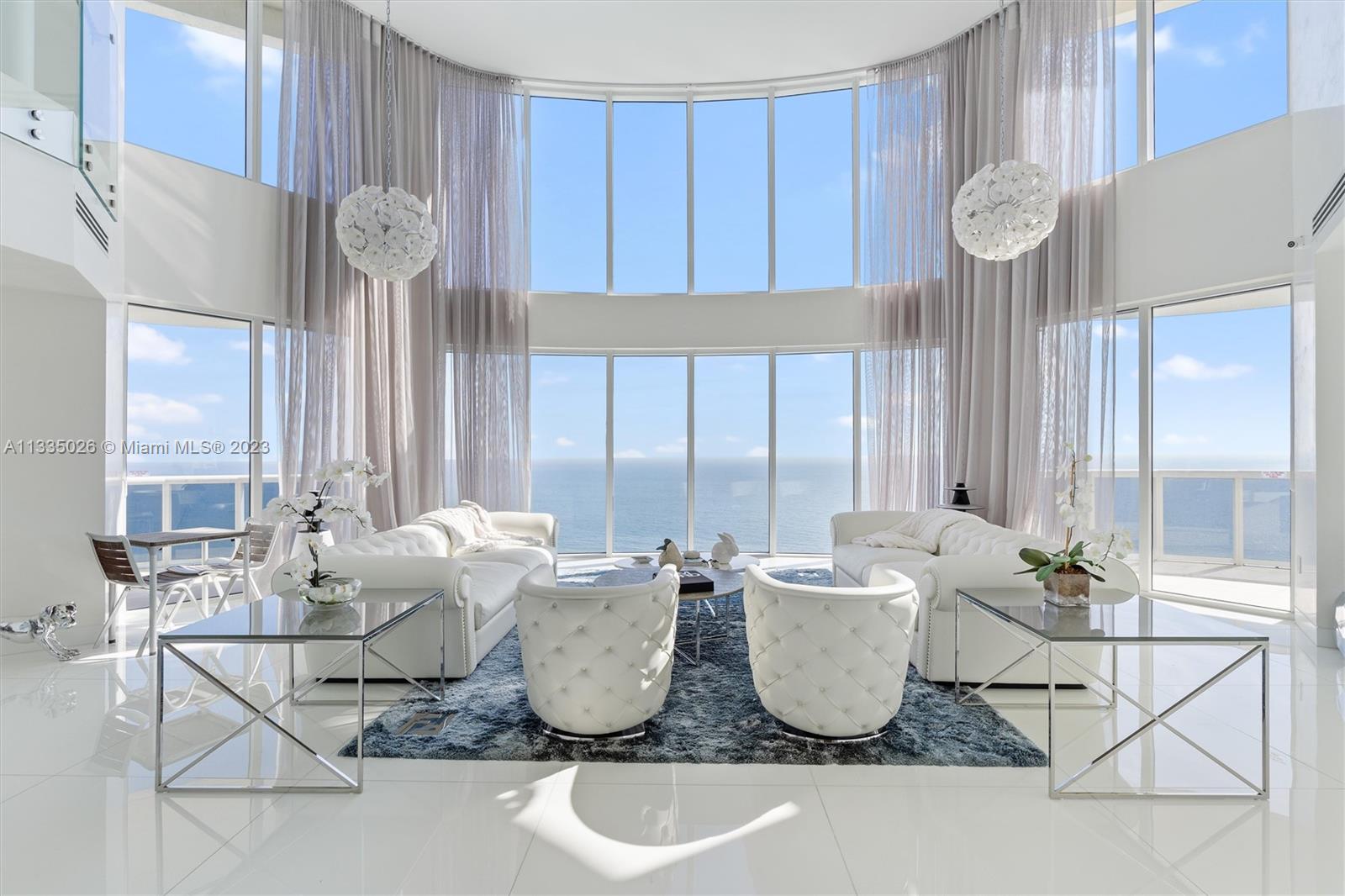 17201 Collins Avenue, Unit 4101 Sunny Isles Beach, FL 33160 - Photo 1 of 32 a dining room with furniture and window