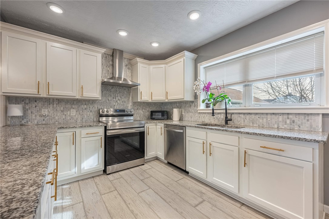 436 Marjorie Avenue Riverside, OH 45404 - Photo 8 of 34 This bright kitchen features ample counter space and modern appliances, perfect for everyday living.