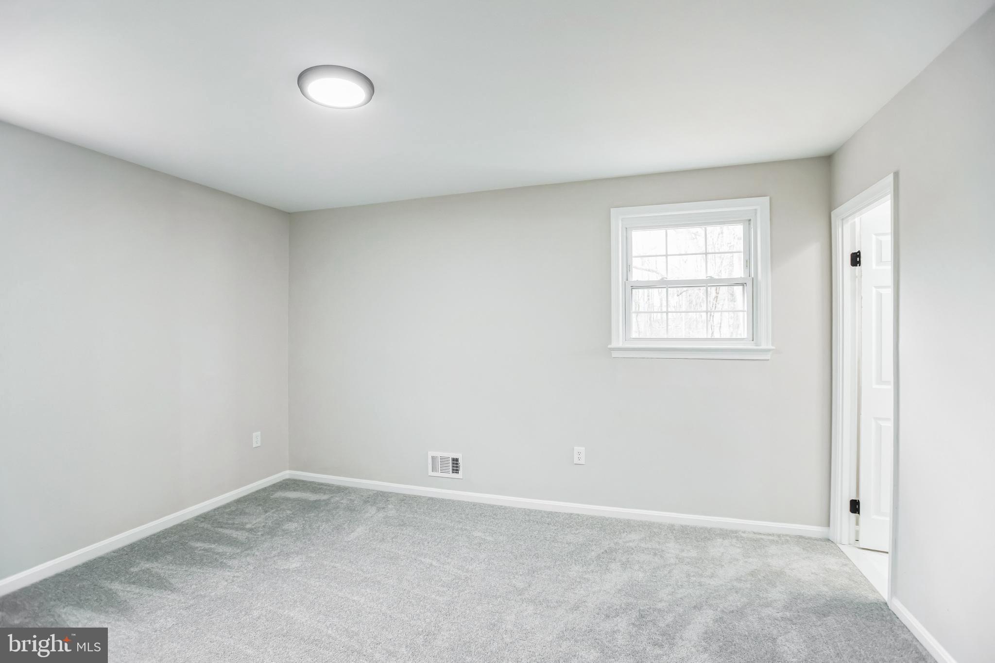 5201 Roblee Drive Upper Marlboro, MD 20772 - Photo 20 of 27 an empty room with windows