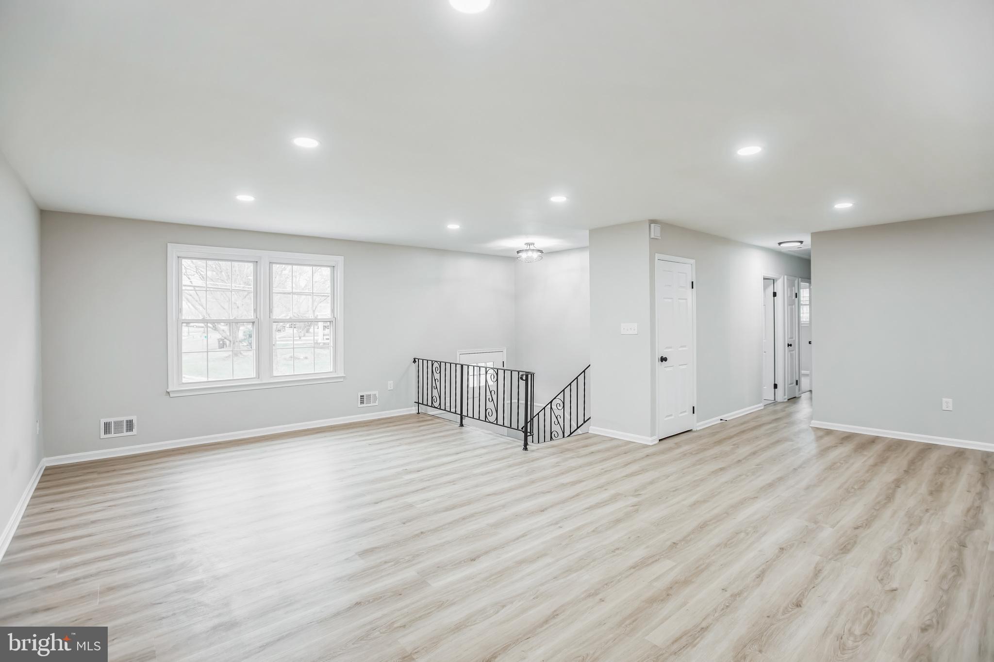 5201 Roblee Drive Upper Marlboro, MD 20772 - Photo 3 of 27 a view of an empty room with wooden floor and a window