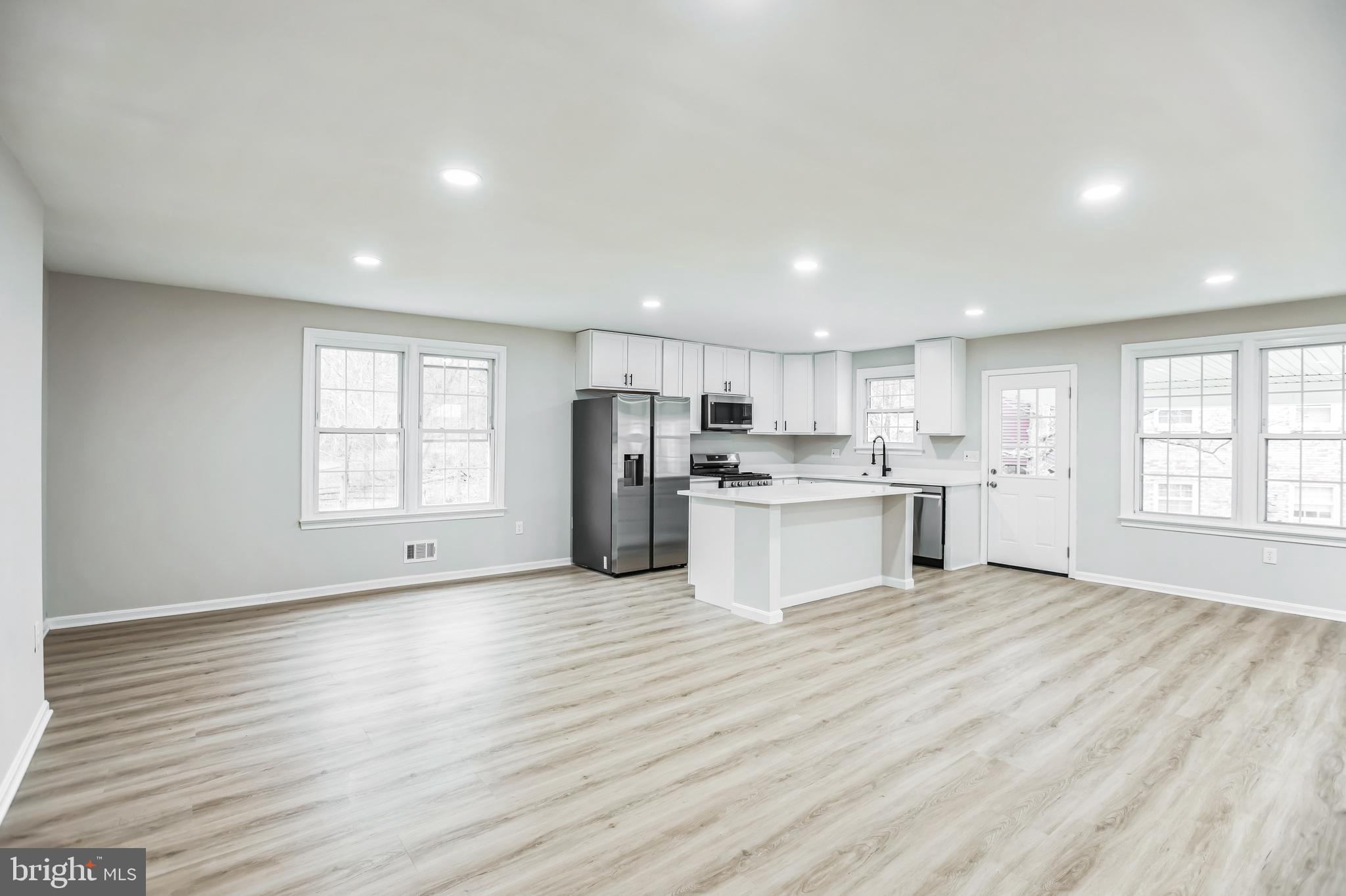 5201 Roblee Drive Upper Marlboro, MD 20772 - Photo 6 of 27 a view of kitchen with wooden floor and windows