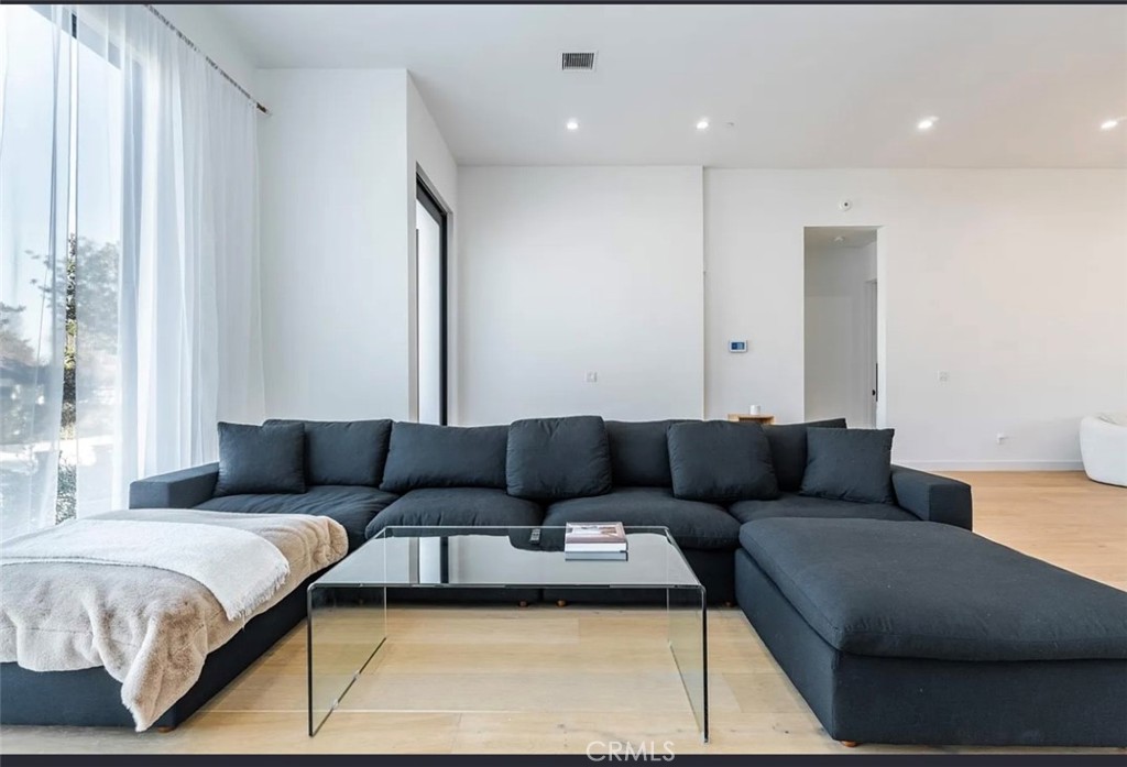 12136 Clarkson Road Los Angeles, CA 90064 - Photo 14 of 23 a living room with furniture and a couch