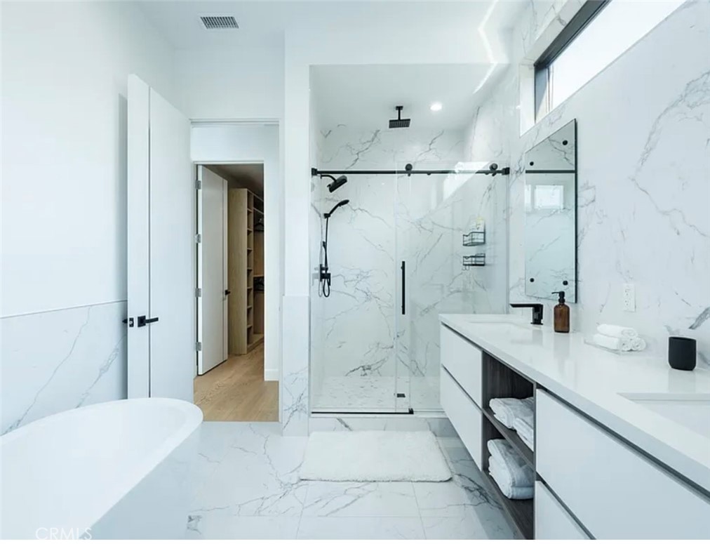 12136 Clarkson Road Los Angeles, CA 90064 - Photo 16 of 23 a bathroom with a tub sink shower and mirror