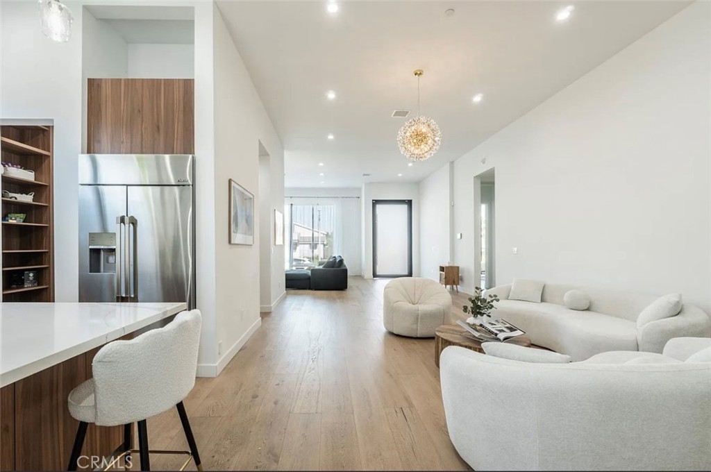 12136 Clarkson Road Los Angeles, CA 90064 - Photo 9 of 23 a living room with furniture wooden floor and a large window