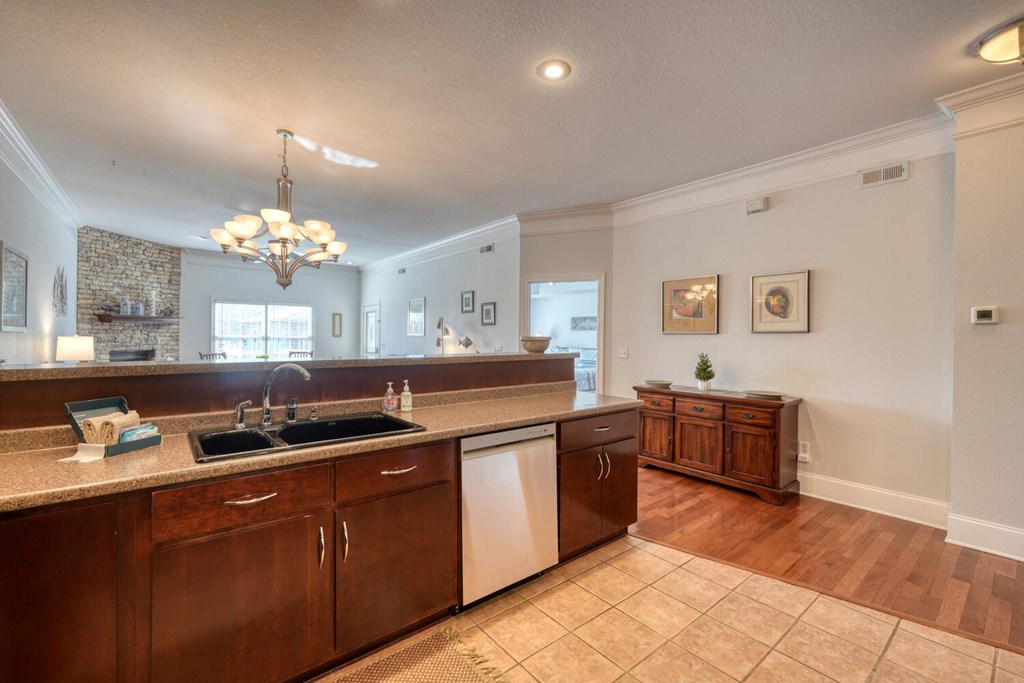 1727 Watercrest Way Young Harris, GA 30582 - Photo 12 of 39 a kitchen with stainless steel appliances granite countertop a sink a stove and a wooden cabinets