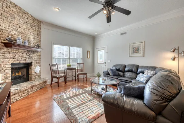 a living room with furniture and a fireplace