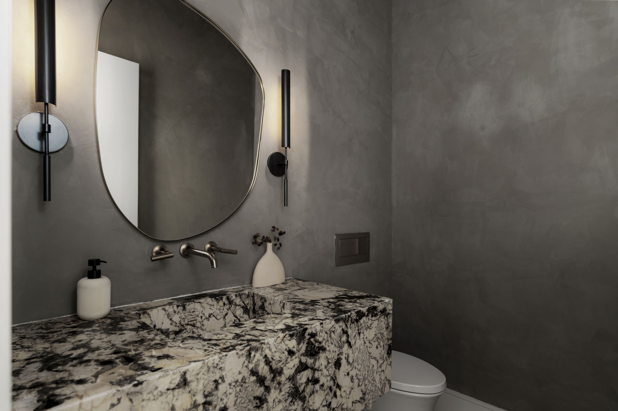 3411 Bridle Path Austin, TX 78703 - Photo 15 of 34 a bathroom with a toilet sink and mirror