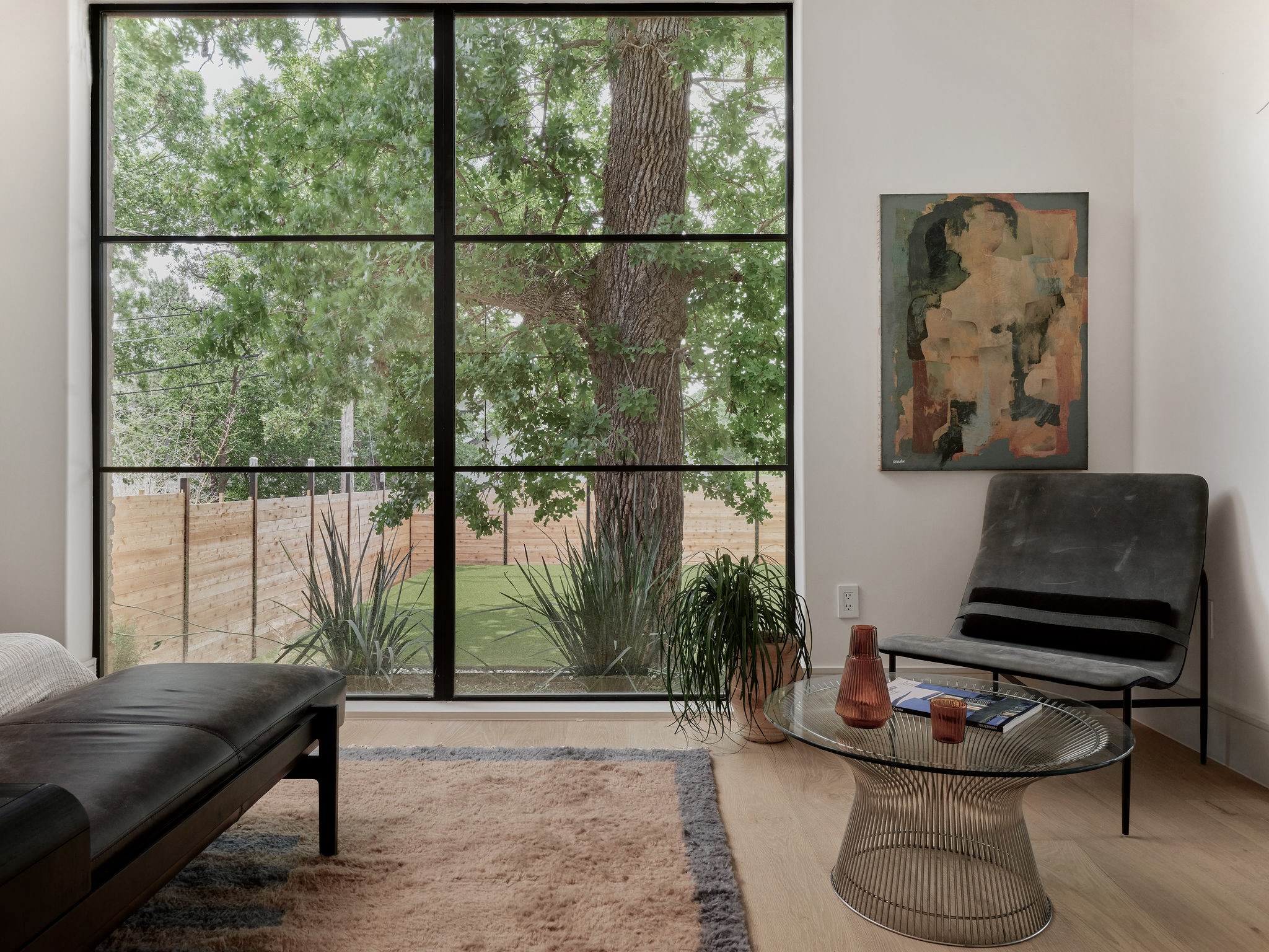 3411 Bridle Path Austin, TX 78703 - Photo 17 of 34 a living room with furniture and a floor to ceiling window