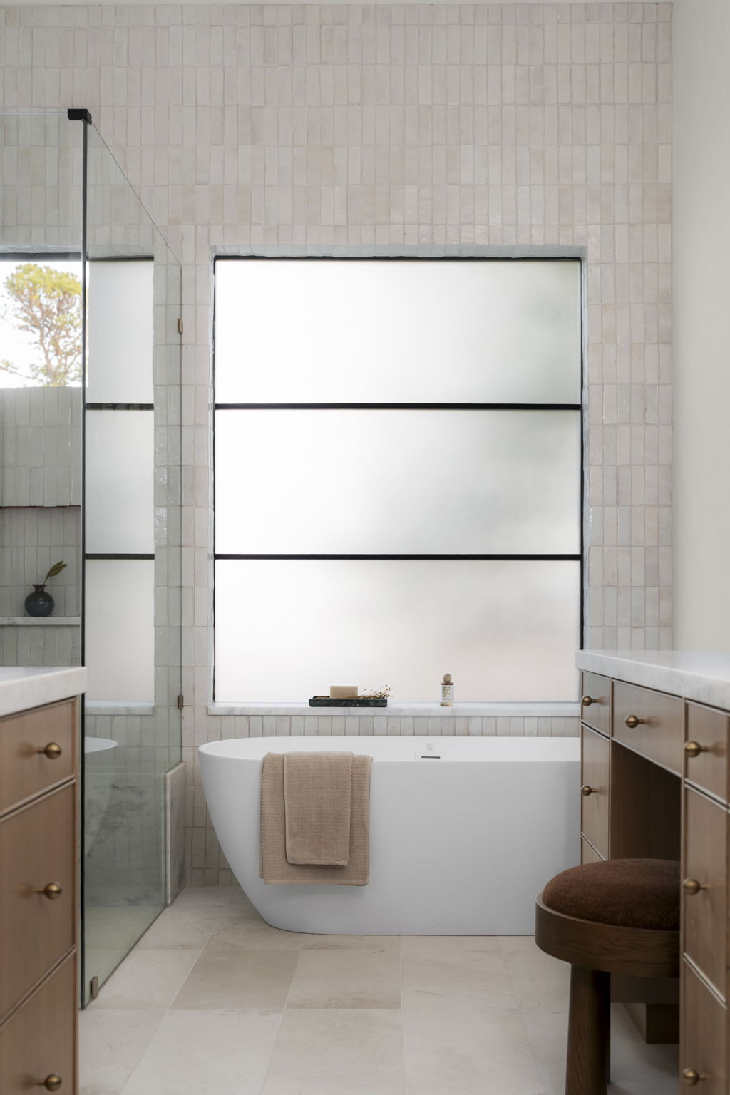 3411 Bridle Path Austin, TX 78703 - Photo 18 of 40 Full bath with vanity, tile walls, a freestanding tub, and walk in shower