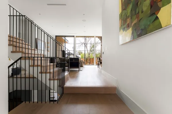 a living room with furniture or stairs and a wooden floor