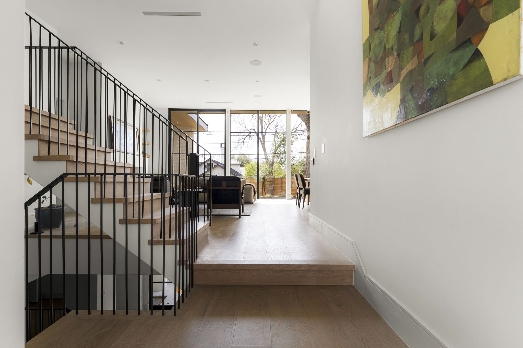 3411 Bridle Path Austin, TX 78703 - Photo 19 of 40 Hallway featuring light wood-style flooring and expansive windows