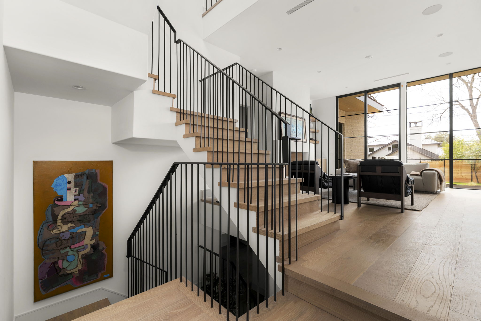 3411 Bridle Path Austin, TX 78703 - Photo 21 of 40 Stairs featuring wood finished floors and floor to ceiling windows