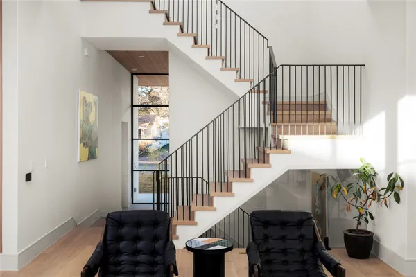 a view of a living room and balcony