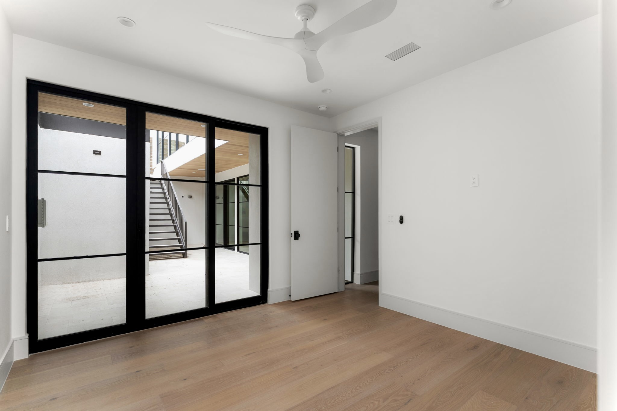 3411 Bridle Path Austin, TX 78703 - Photo 25 of 34 a view of an empty room with a window