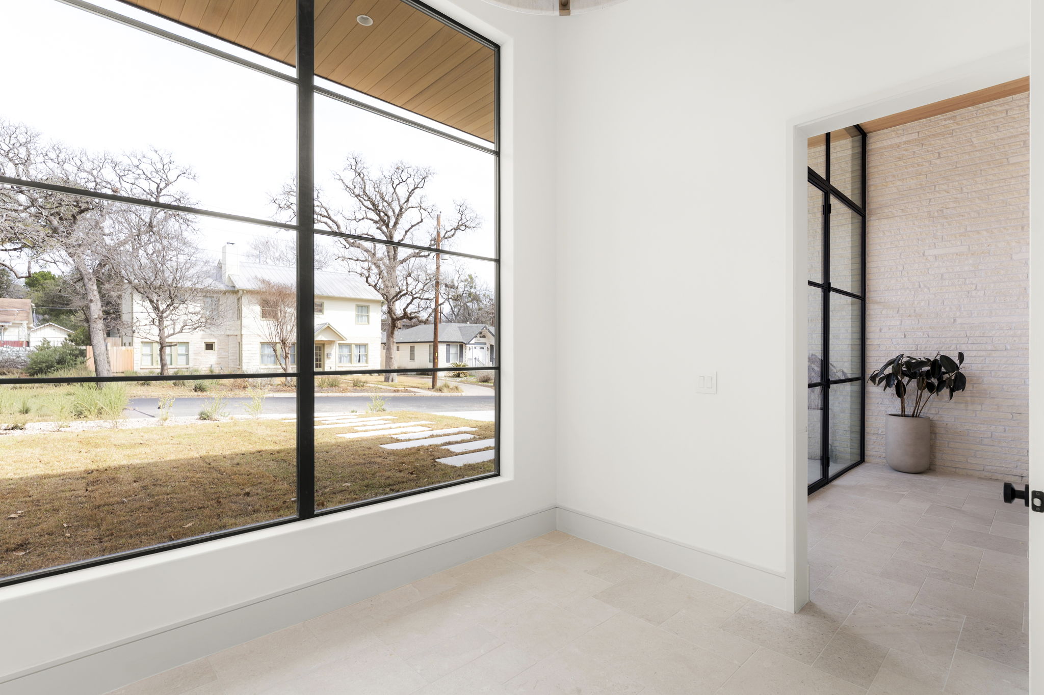 3411 Bridle Path Austin, TX 78703 - Photo 27 of 40 Spare room with baseboards and a residential view
