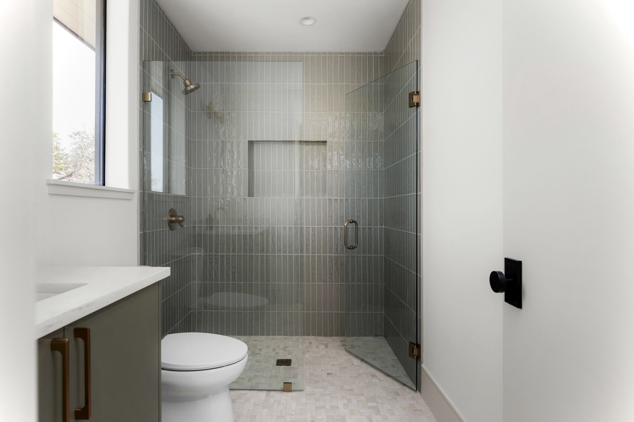 3411 Bridle Path Austin, TX 78703 - Photo 30 of 34 a bathroom with a shower a toilet and a sink