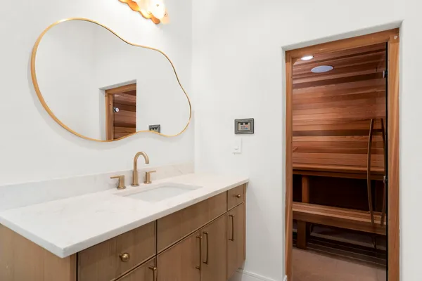 a view of an empty room and a wooden floor