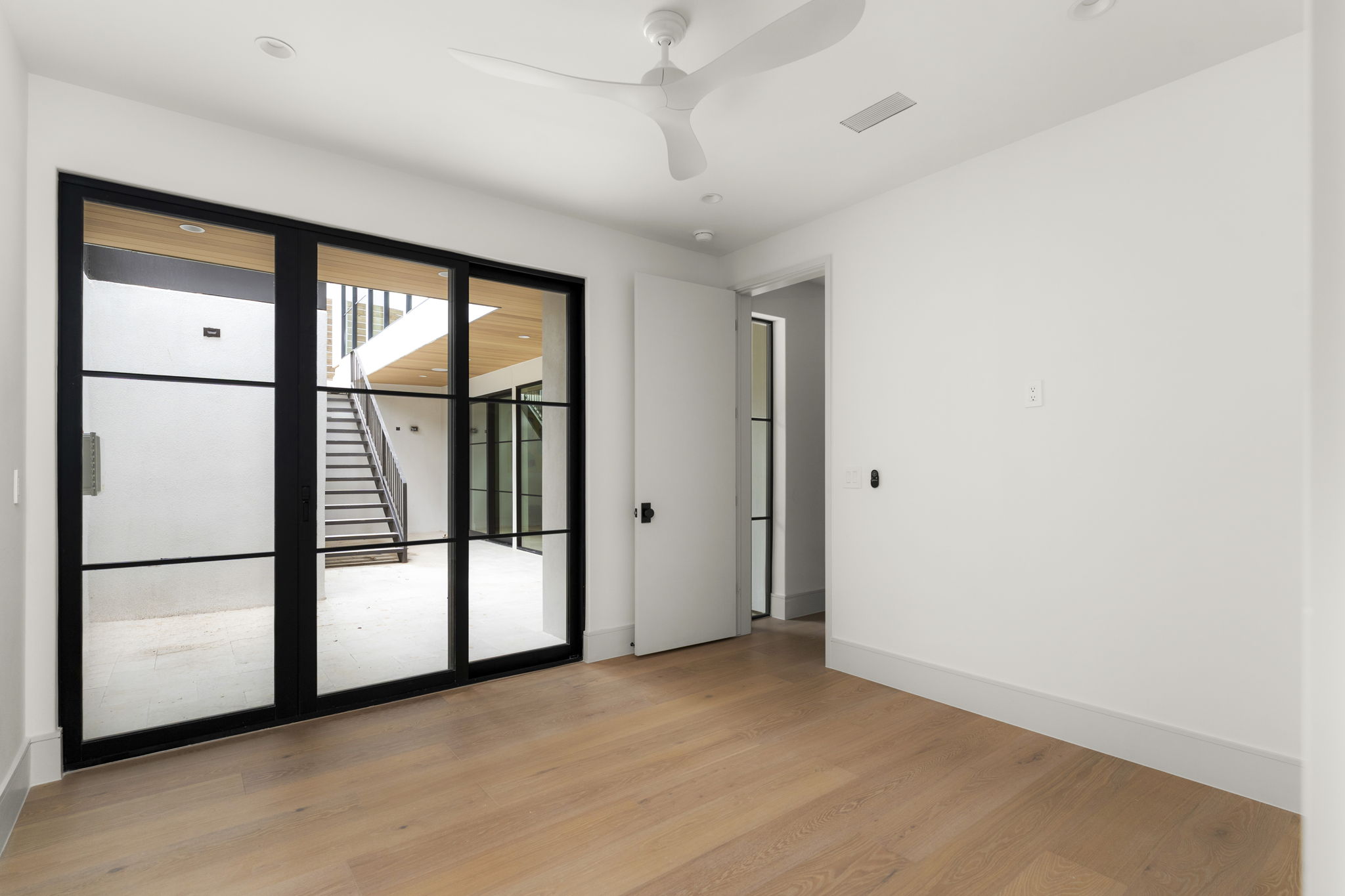 3411 Bridle Path Austin, TX 78703 - Photo 38 of 40 Spare room featuring light wood-style floors and ceiling fan