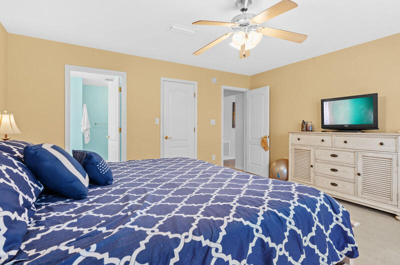186 Shipwreck Road Santa Rosa Beach, FL 32459 - Photo 16 of 37 a bedroom with a bed and closet