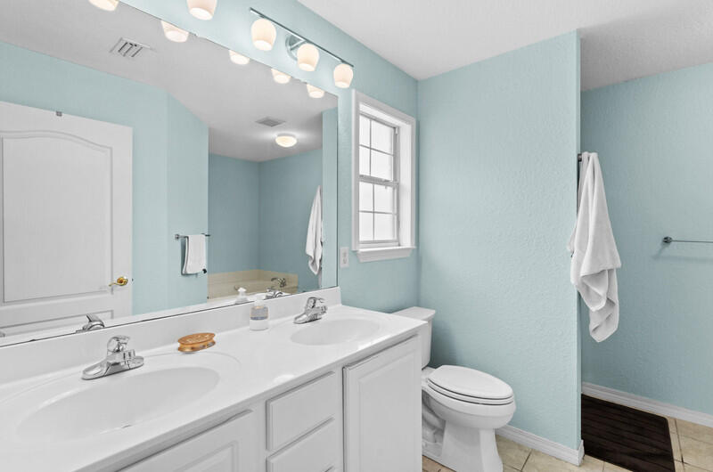 186 Shipwreck Road Santa Rosa Beach, FL 32459 - Photo 17 of 37 a bathroom with a sink toilet and a mirror